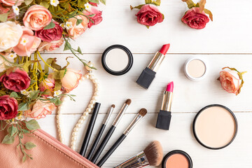 Obraz na płótnie Canvas Valentine Gift. Makeup cosmetics tools background and beauty cosmetics, products and facial cosmetics package with flower rose and Pearl necklace. Lifestyle and Valentine