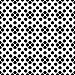 Seamless pattern with black dots on white background