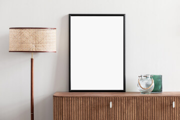 Blank picture frame mockup on white wall. Template for painting or poster. White living room interior design. View of modern rustic style interior with artwork mock-up