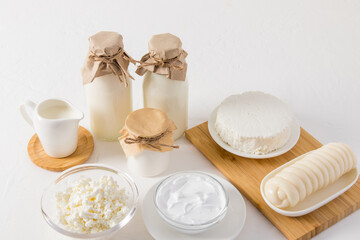 fresh organic dairy products on a white table. probiotic, farmed dairy products.