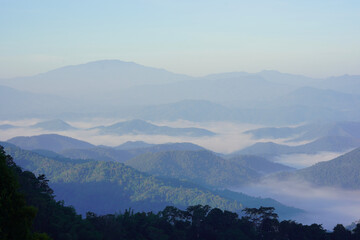 green mountain with foggy