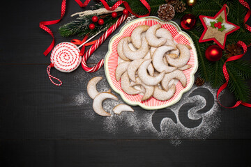 Traditional German or Austrian Vanillekipferl vanilla kipferl cookies on decorated ceramic plate