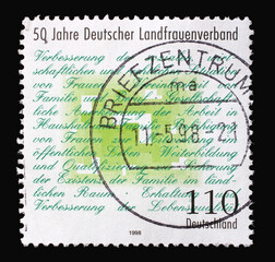 A stamp printed in Germany shows Association Manifesto, 50th anniversary of German Rural Women's Association, circa 1998