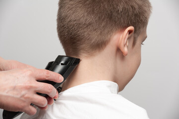 haircut on the back of the head and neck using a hair clipper