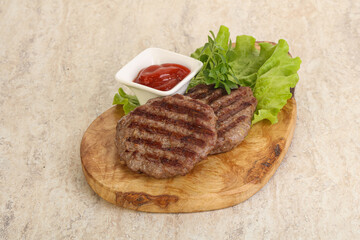 Grilled beef burger cutlet with sauce