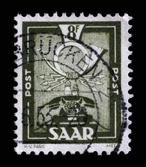Stamp from Germany area Saar shows Postal and communications symbols, circa 1951