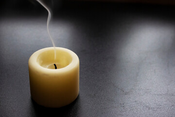 The flame of a dead candle and its smoke