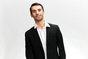 white man in a business suit with a smile on his face successful trader leadership qualities white studio background, copy space