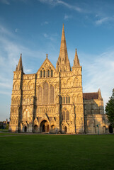 West façade of Salisbury Cathedral, Wiltshire, against a clear blue sky. July 2021