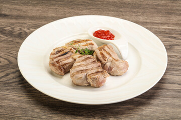 Grilled pork tenderlion with tomato sauce