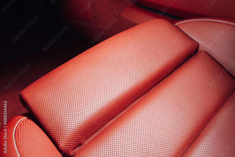 Wall mural Red leather car seats in the expensive sport car