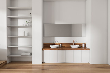 Fototapeta na wymiar Bright bathroom interior with two sinks, mirror, shelf with towels
