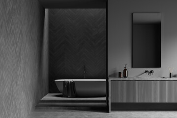 Grey bathroom interior with sink and bathtub in the corner