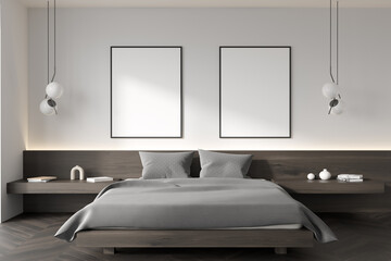 Light bedroom interior with bed and nightstand with decoration. Mockup posters