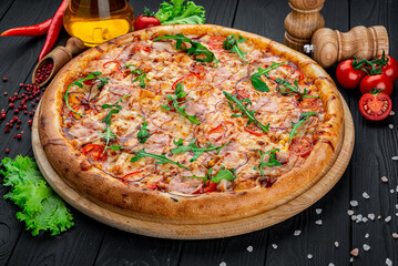 Delicious Italian pizza with sausage, ham and vegetables