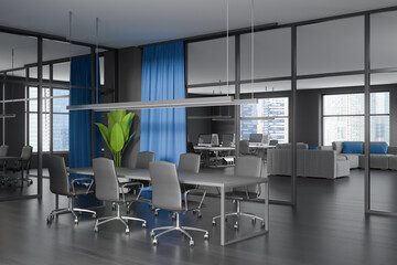 Corner view on dark office interior with desk with desktop