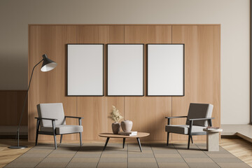 Light guest room interior with seats, coffee table and mockup posters
