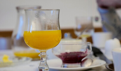 Glasses of morning juice on the breakfast table  - 488317668