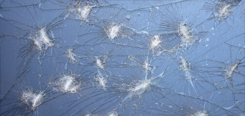 There are many cracks on the blue glass.Broken windows. The screen is cracked.