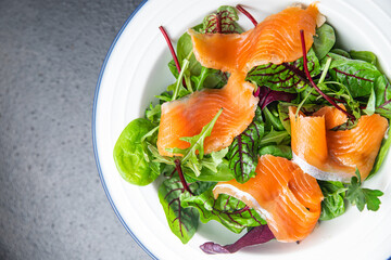 salmon salad slices fish green salad mix leaves seafood fresh healthy meal food diet snack on the table copy space food background 