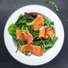 salmon salad slices fish green salad mix leaves seafood fresh healthy meal food diet snack on the table copy space food background 