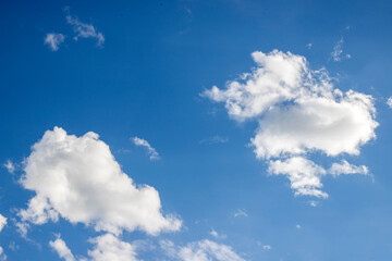 white clouds on blue sky background. Bright blue background. Relaxing feeling like being in the sky.