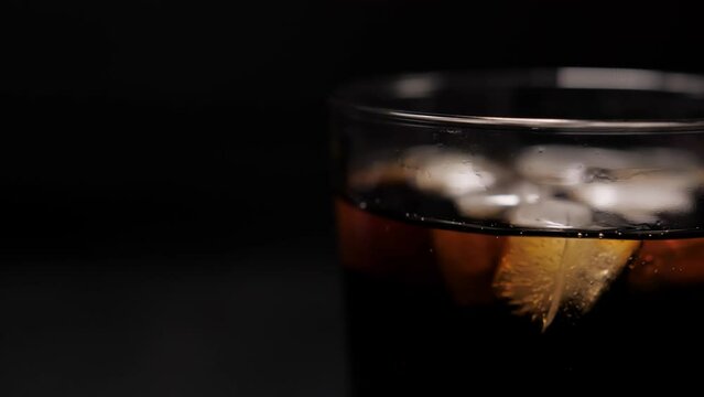 cola coke with ice cubes on cold glass slow motion 4k
