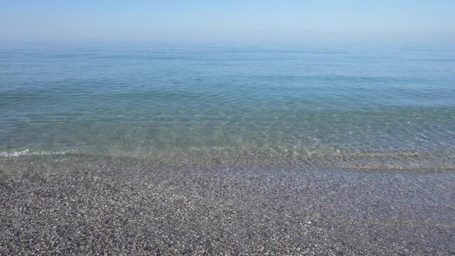 Morning calm surface of the sea with haze in cold colors. Calm peaceful sea background for meditation