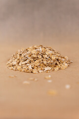 Oatmeal in a spoon.
Healthy oatmeal.
Scattered oatmeal on the table.