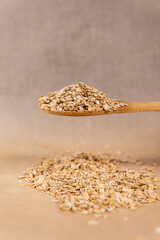 Oatmeal in a spoon.
Healthy oatmeal.
Scattered oatmeal on the table.