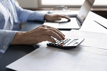 Close up mature old woman doing financial audit, managing household budget, planning investment,...