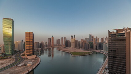 Obraz premium Cityscape skyscrapers of Dubai Business Bay with water canal aerial timelapse.