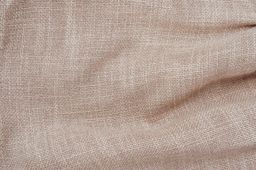 Jute hessian sackcloth woven burlap texture background in sepia cream old aged brown color