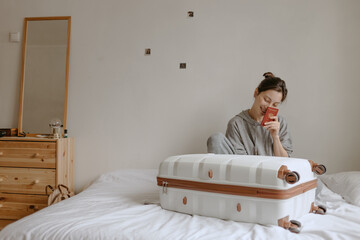 woman with the baggage at home