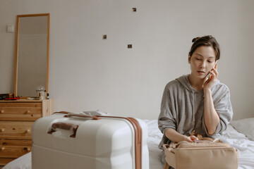 woman with the baggage at home