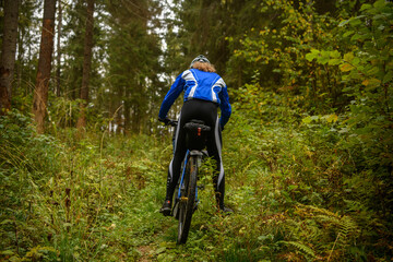 Bicyclist in the forest, Russia