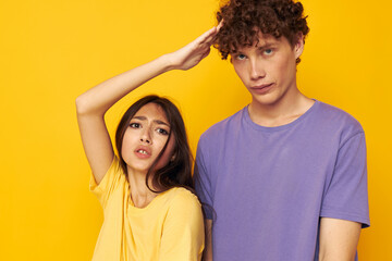 Fototapeta premium portrait of a man and a woman in colorful t-shirts posing friendship fun isolated background unaltered
