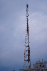 scaffolding with antennas on a blue background