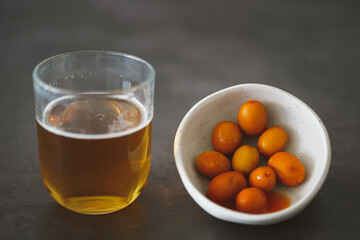 Image of a cold beer along with some olives
