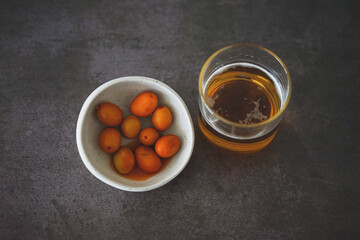 Image of a cold beer along with some olives