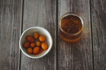 Image of a cold beer along with some olives