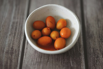 Spiced olives in a white bowl