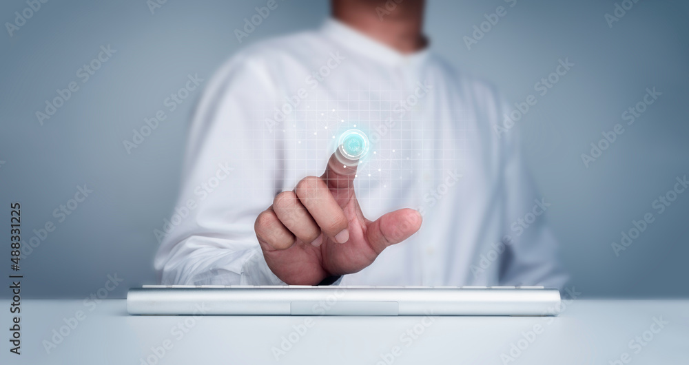 Poster finger scan icon appeared on virtual screen while businessman's finger scanning for security access 