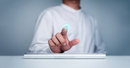 Finger scan icon appeared on virtual screen while businessman's finger scanning for security access with biometrics identification. Cyber security, privacy data protection technology for business.