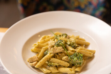 Penne pasta with pesto cream sauce