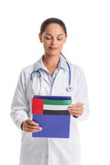 Female doctor with flag of UAE on white background