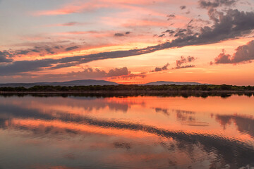 Beautiful sunset taken in Port Leucate South of France with sky reflection in a Mediterranean...