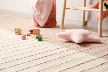 Stylish carpet and toys in child room