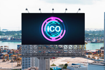 ICO hologram icon on billboard over panorama city view of Singapore at day time. The hub of...