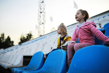 Plastic chairs in the stands of a sports stadium. Cheer on the stands of the stadium.